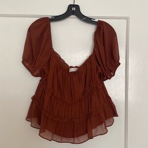 Astr the label burnt orange/copper top